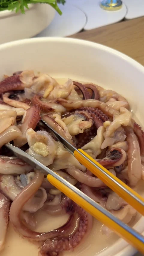 Cooked Octopus and Squid at a Seafood Buffet Stock Footage 345396827
