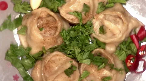 Cooked oriental dumplings on the plate rotating Stock Footage 43185238