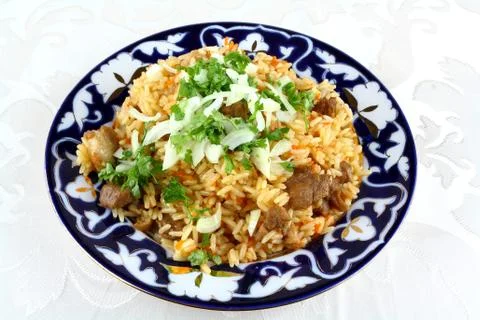 Cooked oriental risotto, meat with rice, closeup Stock Photos