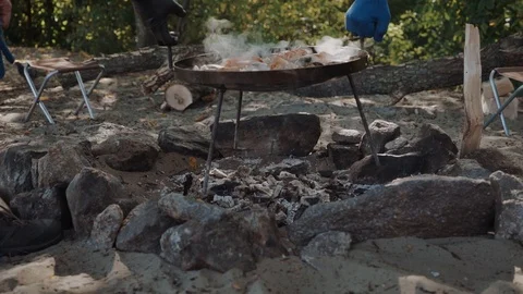 Cooked paella with crayfish on a campfire Stock Footage 99305272