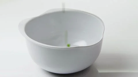 Cooked peas falling into a measuring jug Stock Footage 8572269