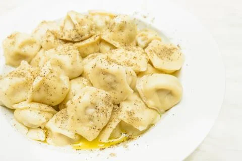 Cooked pelmeni sprinkle with pepper Stock Photos