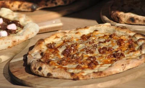 Cooked pizza ready to comming out of the oven Stock Photos