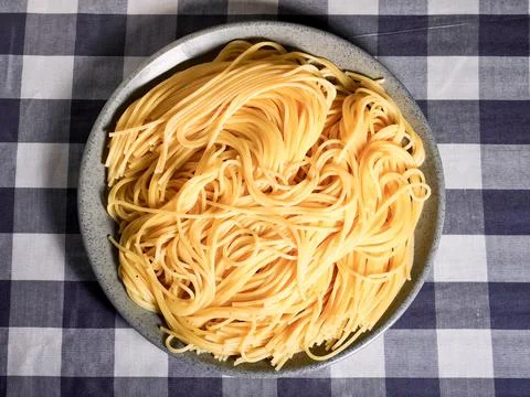 Cooked plain spaghetti on gray plate Stock Photos