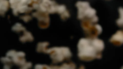 Cooked popcorn falling into a pan Stock Footage 274643511