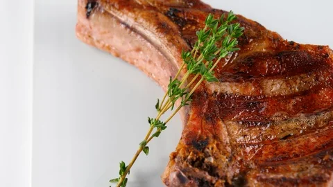 Cooked pork chop, meat grilled on barbecue, Restaurant food Stock Footage 87606153