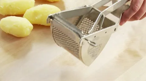 Cooked potatoes being mashed Stock Footage 24643030