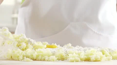 Cooked potatoes being mixed with flour and egg Stock Footage 24643087