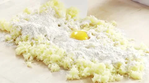 Cooked potatoes being mixed with flour and egg Stock Footage 24643098