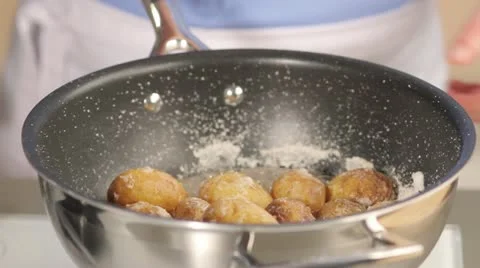 Cooked potatoes with a salt crust in a pot Stock Footage 24671380
