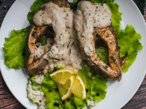 Cooked red fish dish with cream sauce Stock Photos