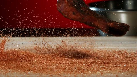 Cooked rib falls into spice rub in slow motion Stock Footage 327789793