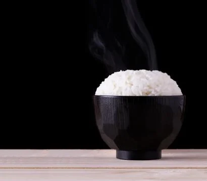 Cooked Rice on Black Background Stock Photos