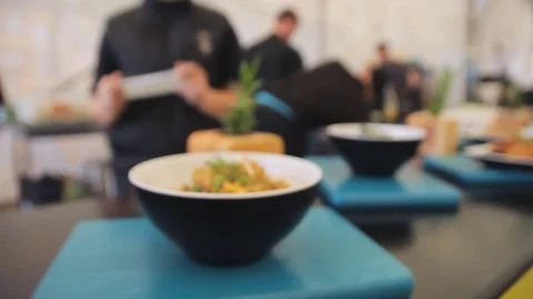 Cooked rice with herbs and vegetables in a plate on a table. Zooming camera. Video stock 74806353