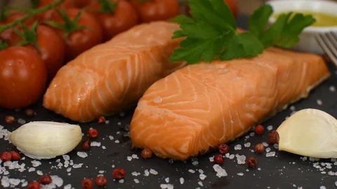 Cooked salmon fish fillets with spices Stock-Footage 125685327