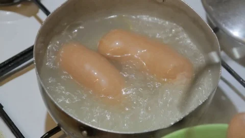 Cooked sausages in a pan Video stock 72122128