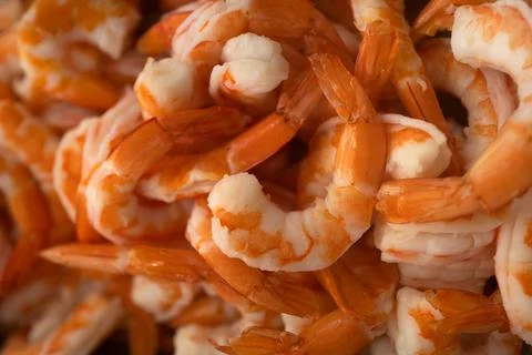 Cooked shrimp macro texture closeup. Orange prawns delicious seafood dish. High 库存照片