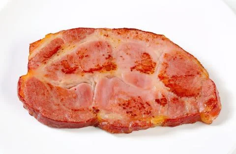 Cooked sliced ham on plate Stock Photos
