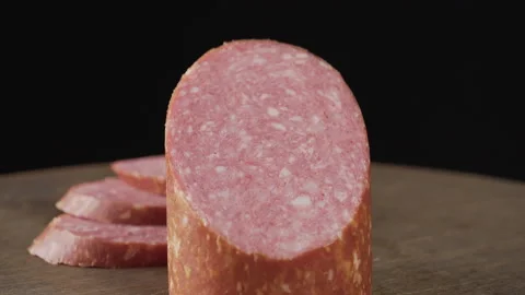 Cooked smoked sausage on a dark background Stock Footage 133243067