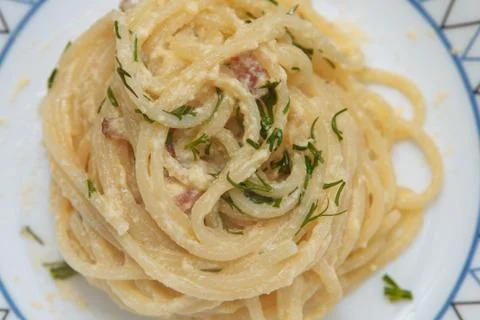 Cooked spaghetti with parmesan paste, carbonara, cream sauce Stock Photos