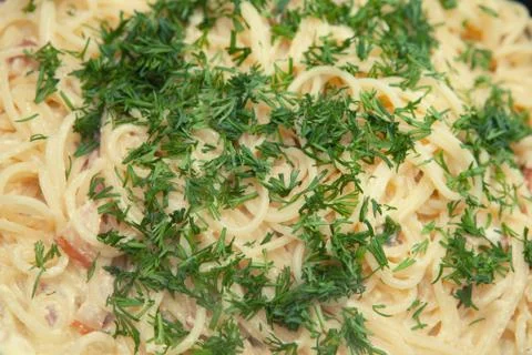 Cooked spaghetti with parmesan paste, carbonara, cream sauce Stock Photos