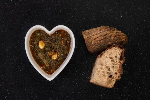 Cooked Spinach and Bread Slices Stock Photos
