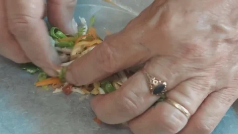 Cooked spring rolls with egg and vegetables Stock Footage 70375846