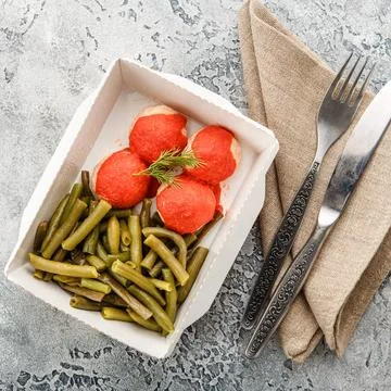 Cooked string beans Boiled string beans and fish balls in sauce in a lunch... Stock Photos