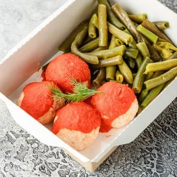 Cooked string beans Boiled string beans and fish balls in sauce in a lunch... Stock Photos