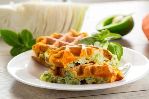 Cooked two-color vegetable waffles made from cabbage and carrots. Stock Photos