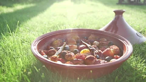 Cooked vegetable dish in the sunlight cooking in tazhin spicy food Stock Footage 143782414