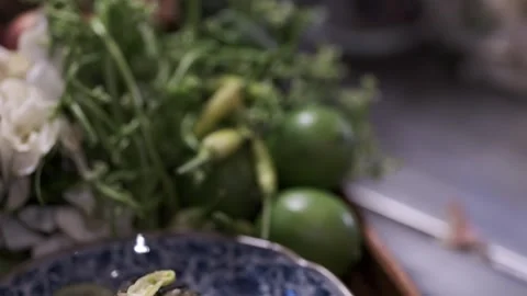 A cooked vegetable or salad is on a plate with fresh ingredients on the side Stock Footage 145354648