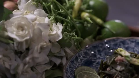 A cooked vegetable or salad is on a plate with fresh ingredients on the side Stock Footage 145354723