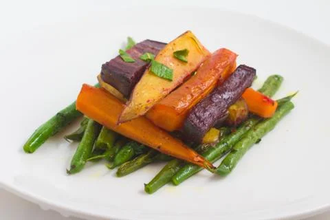 Cooked Vegetables and roots. Beet, carrot, pod and sweet potato Stock Photos