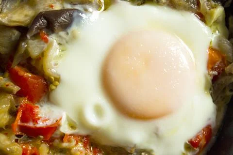 Cooked vegetables with poached egg Stock Photos