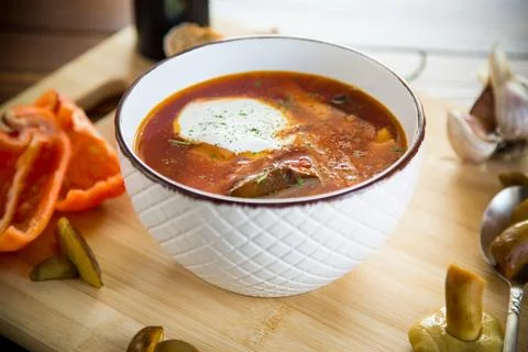 Cooked vegetarian beetroot soup with mushrooms and other vegetables in a bo.. Stock Photos