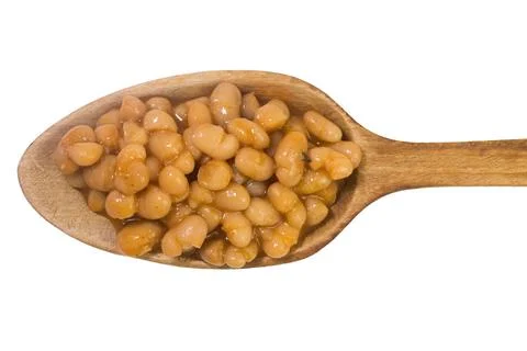 Cooked white beans on a spoon Stock Photos