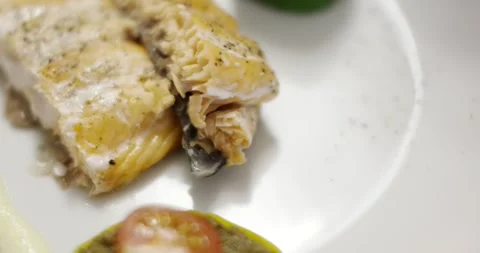 Cooked White Fish Fillet with Crispy Skin, Gourmet Plating Close Up Shot Stock Footage 340321254