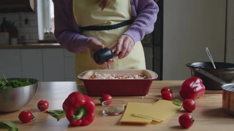 Cooker Is Adding Spices to Meal Video stock 170514882