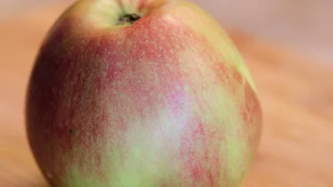 Cooker cutting a ripe apple Stock Footage 81951004