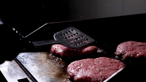 Cooker grill burger cutlet using blade 4k Stock Footage 94263931