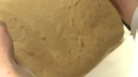 Cooker putting dough on the table Stock Footage 119552503