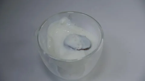 Cookie and the milk splash Stock Footage 243954097