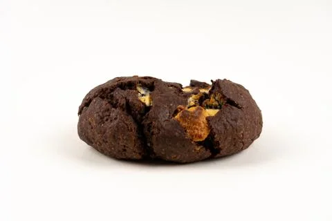 A cookie cake with chocolate on white background with copy space - angled vie Stock Photos