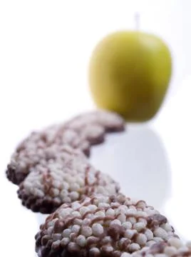 Cookie chain and apple Stock Photos