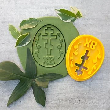 Cookie cutter for cutting Easter biscuits on dough for kids Stock Photos