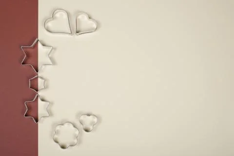 Cookie cutters on double-colored background. Stock Photos