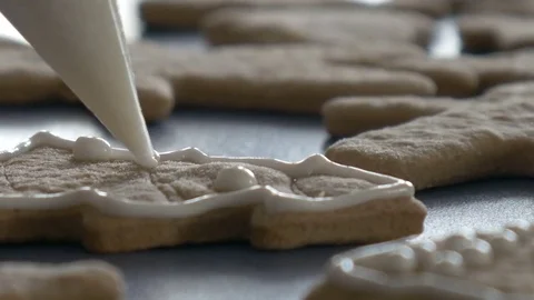 Cookie is decorated with glaze, extreme closeup, dolly shot, ungraded Stock Footage 83445833