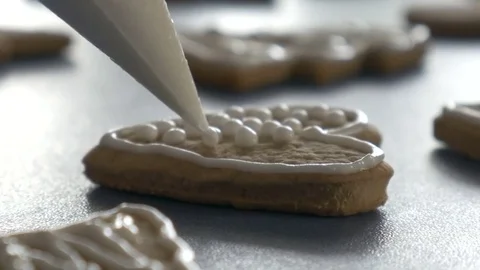 Cookie is decorated with glaze, extreme closeup dolly shot, ungraded Stock Footage 83446935