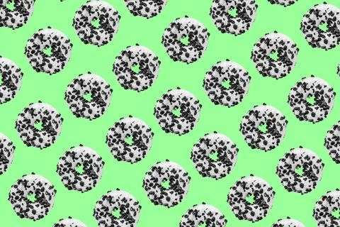 Cookie donut pattern on green background Stock Photos